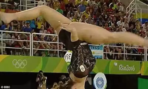 PHOTOS: Olympic Gymnast Performs Incredible Back Flip And Her Head Doesn
